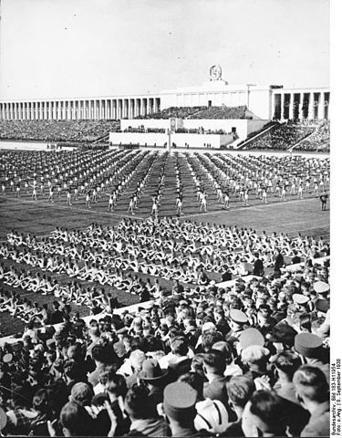 Nuremberg Rally. Mass calisthenics on the Zeppelin Meadow on September 8, 1938, the “Community Day.” Source: [https://commons.wikimedia.org/wiki/File:Bundesarchiv_Bild_183-H11954,_N%C3%BCrnberg,_Reichsparteitag,_Turnvorf%C3%BChrung.jpg Bundesarchiv Signatur: Bild 183-H11954] [https://creativecommons.org/licenses/by-sa/3.0/de/deed.en CC BY-SA 3.0 DE]